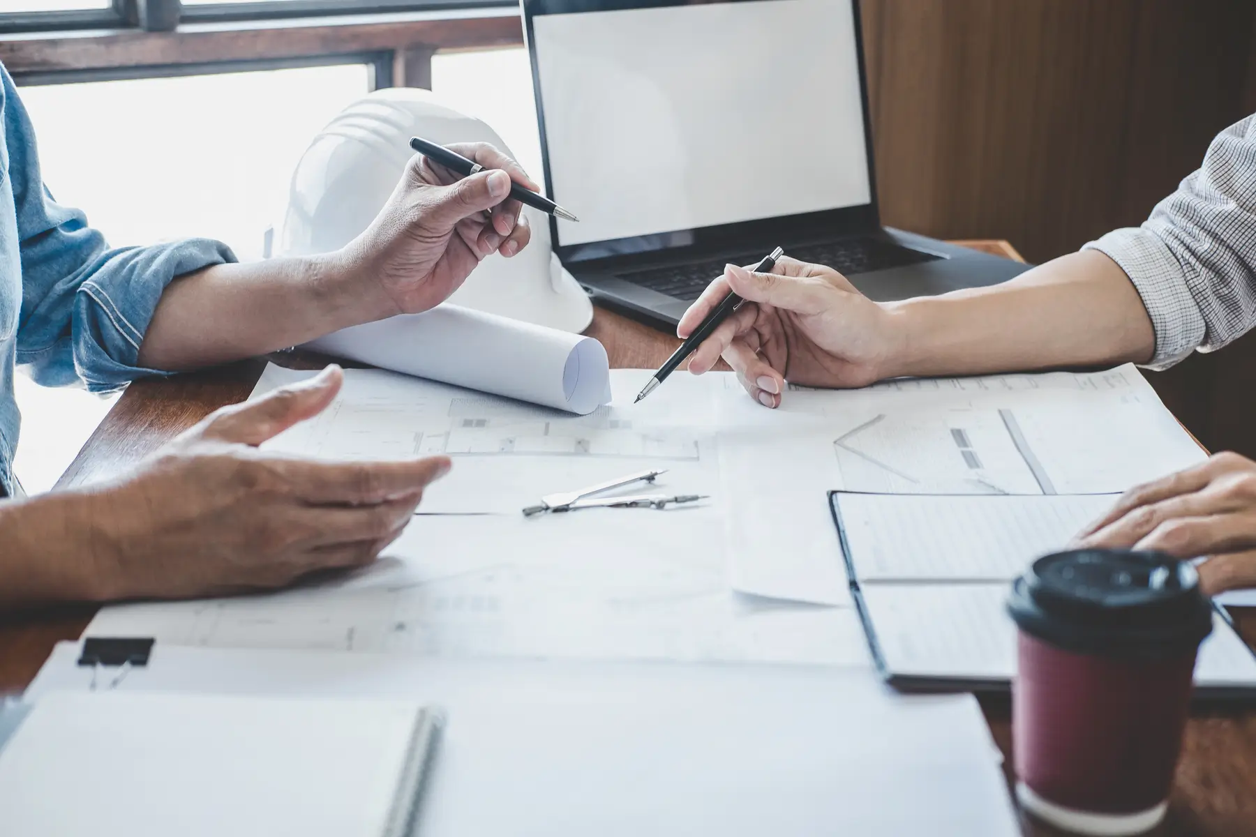 Two construction engineers going over architectural plans